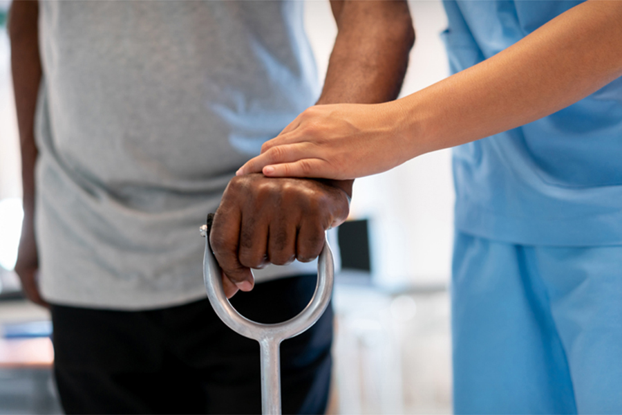 Stock image of hands on cane